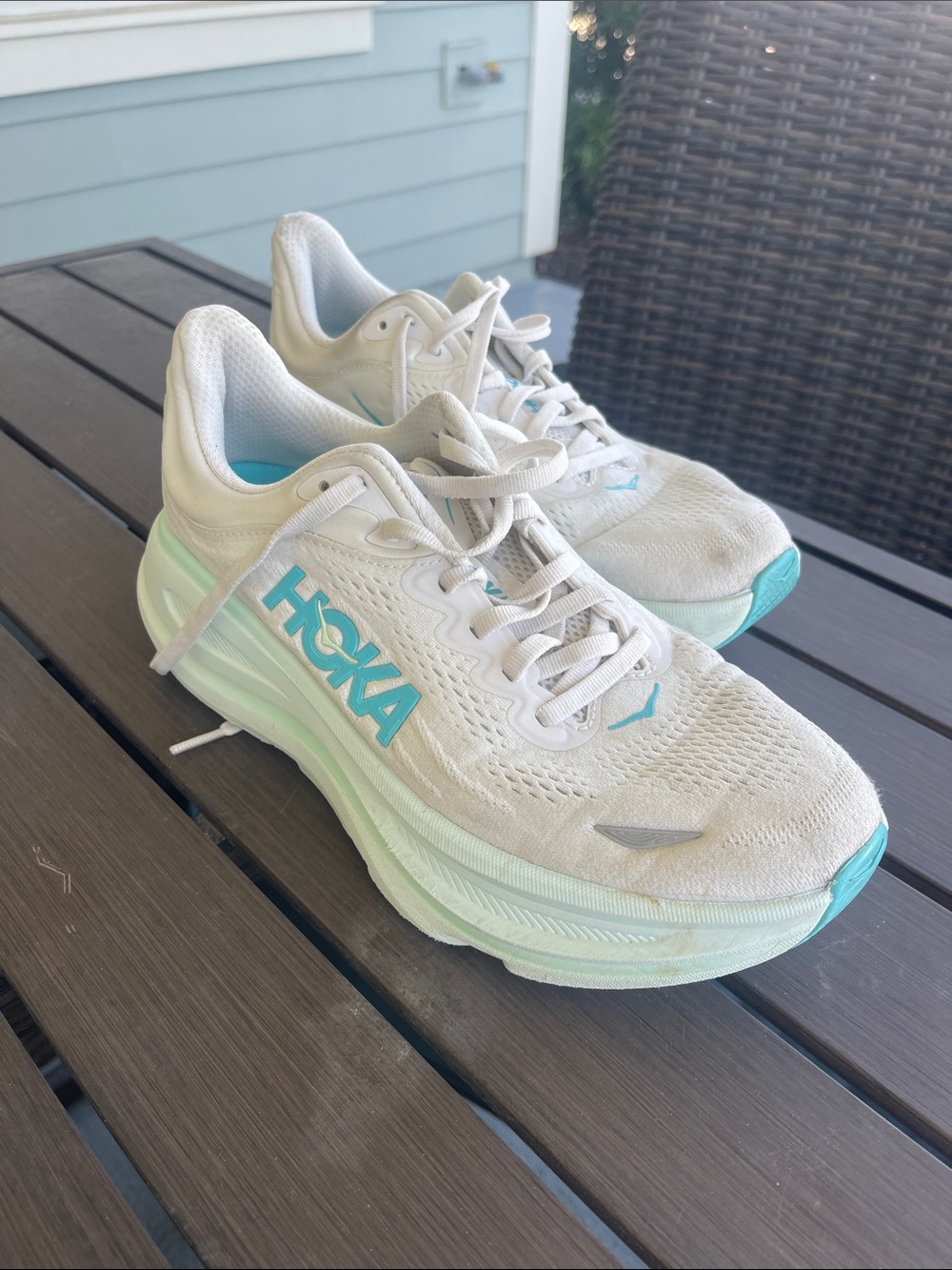 Hoka Women's White Clifton 10 model in the White and Cielo Blue colorway